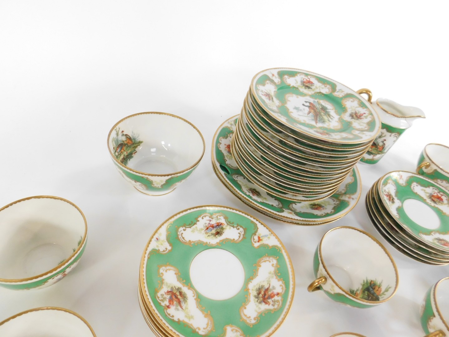 An early 20thC continental porcelain tea service, decorated with vignettes of Chelsea birds - Image 3 of 4