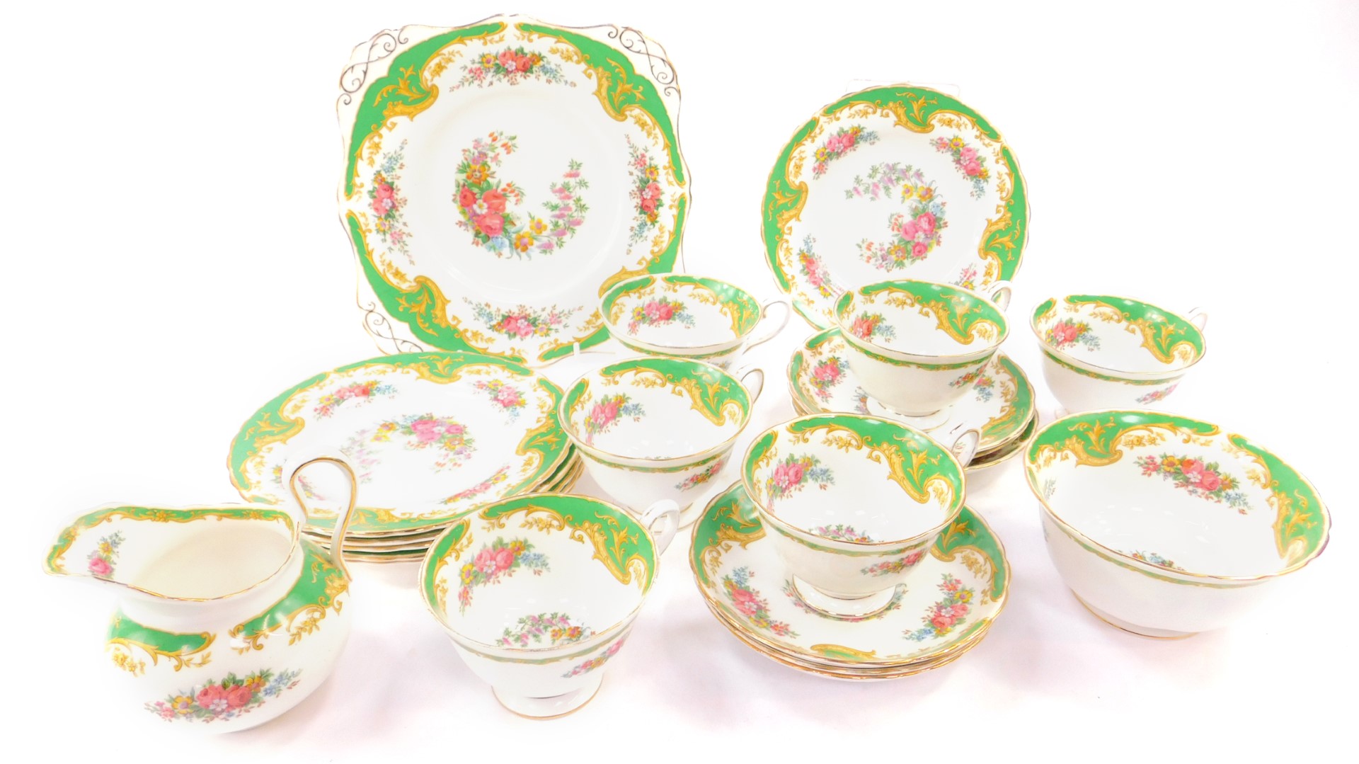 A Tuscan porcelain part tea service decorated in the Naples pattern, comprising bread plate, cream