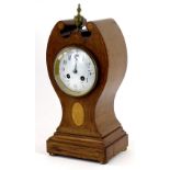An Edwardian mahogany and marquetry tulip shaped mantel clock, with a turned brass finial, the