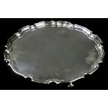 An Elizabeth II silver salver, with a piecrust border and scroll feet, Sheffield 1967, retailed by