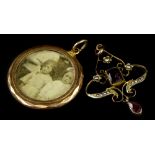 An Art Nouveau pendant and a gilt metal pendant, the Art Nouveau pendant set with amethyst and