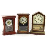 Three mantel clocks, to include an American example with verre eglomise panel decorated with a