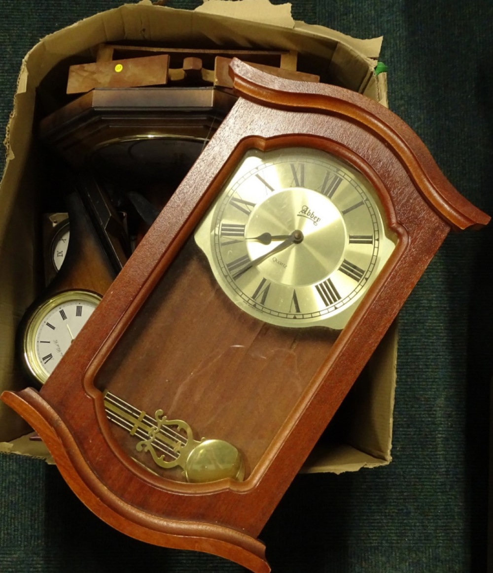 A collection of various wall and other clocks, to include a wooden cased example carved in the