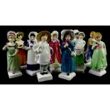 A collection of twelve Royal Doulton Kate Greenaway figurines, each on a square base.