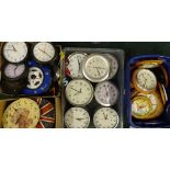 A large quantity of battery operated wall clocks, some with wooden cases, but mainly novelties. (4