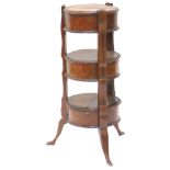 A 19thC French rosewood and kingwood three tier etagere, with three circular compartments, each with