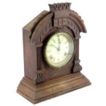 An American mantel clock, in a walnut case, the dial with Roman numerals by the Ansonia Clock