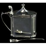 A canted rectangular silver mustard pot, with scroll cast thumb piece and turned finial, blue
