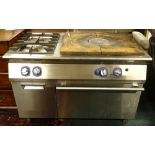 An Electrolux commercial kitchen cooker, comprising two gas hobs, a large hot plate, oven etc.,
