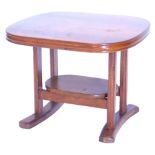 An Eastern hardwood two tier coffee table, the rectangular top with a moulded edge, on square