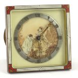 A German Art Deco travelling clock, the dial with a printed decoration of a pierot etc., within a