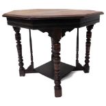 An Edwardian mahogany occasional table, the octagonal top on turned legs with undertier, reduced