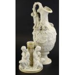 Two items of 19thC Parianware, a ewer with flower encrusted embellishment moulded with putti etc.,