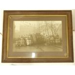 An early 20thC black and white photograph, depicting a First World War tank, various figures, female