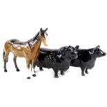 A Beswick black Aberdeen Angus bull and a cow, both 18cm L (cow AF), and a Beswick brown horse.