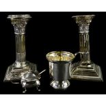 A collection of silver, to include a pair of Corinthian column candlesticks, loaded (AF), a