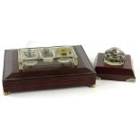 A mahogany ink stand, with separate glass insert for pens, inkwells etc., on brass feet, 30cm W, and