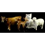 Four Beswick animals, a brown cow (AF), a fawn, a sheep and a cat.