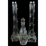 A collection of cut glass items, to include a pair of vases, each with silver collars and a bottle