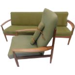 A Danish teak retro style sofa, with a green padded back and seat with shaped arms and turned