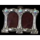 An early 20thC silver mounted double photograph frame, with enamel decoration in Art Nouveau