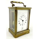 A late 19th/early 20thC French brass carriage timepiece, the white enamel dial with subsidiary