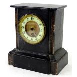 A French black slate mantel timepiece, the enamel type dial with Arabic numerals, 23cm H.Provenance:
