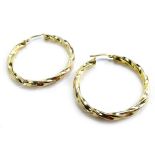 A pair of 9ct gold hoop earrings, each of twist design, 3.2g all in.