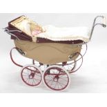 A Silver Cross coach built dolls pram, painted in cream and maroon, sold with a modern child's