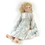 A Felix Arena Mignon bisque headed doll, with composition limbs, impressed aeroplane symbol marked
