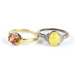 Two 9ct gold dress rings, one with opal and CZ design, the other set with pinky/orange and CZ