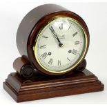 A modern mahogany mantel clock by Comitti of London, on a rectangular base, 21cm W.