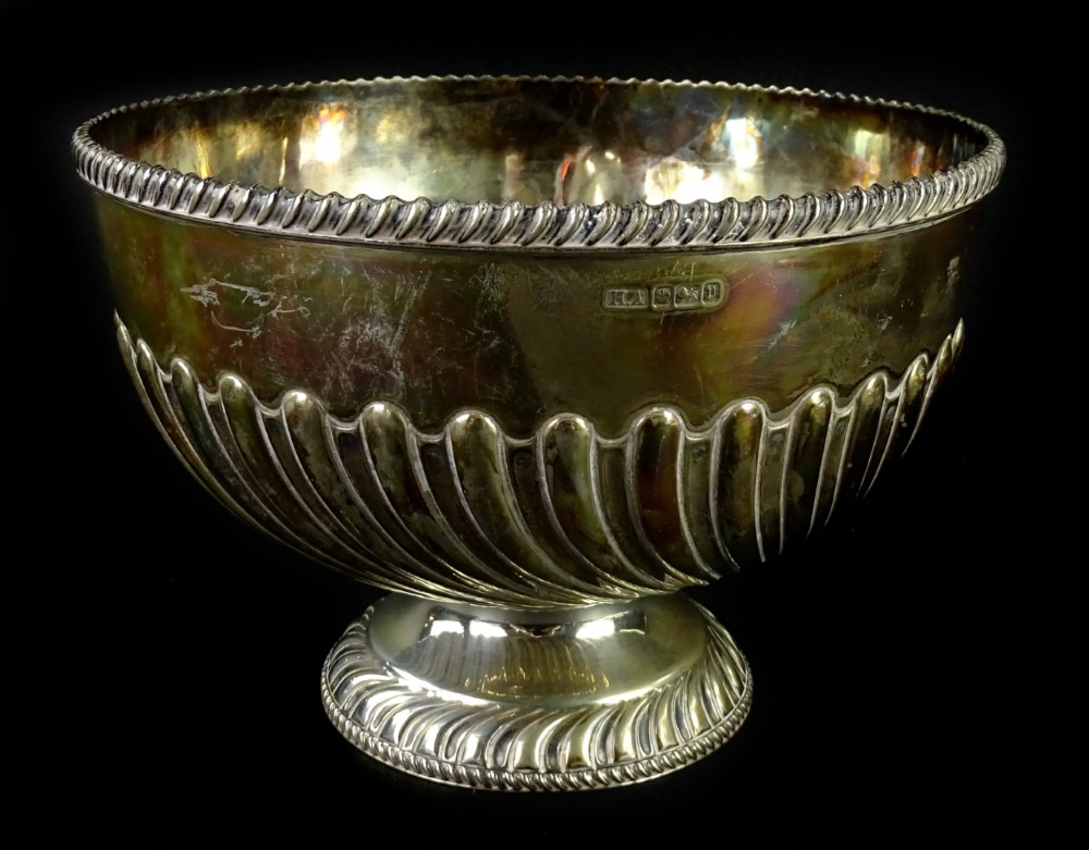 An Edwardian silver rose bowl or cup, with gadrooned border, part fluted decoration, on a domed