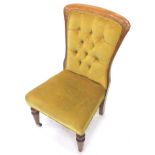 A 19thC mahogany nursing chair, with a buttoned padded back a padded seat on turned legs with