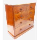 A large Victorian figured mahogany chest of drawers, the top with a moulded edge, above two short