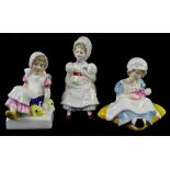 Three Royal Doulton figurines, Ellen, Nell and Cathy.