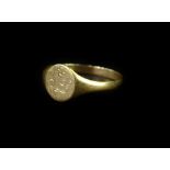 A 9ct gold signet ring, with circular ring head, with partial engraving (rubbed), ring size M½, 1g.