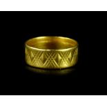 A 22ct gold wedding band, with crosshatch engraving, ring size O½, 6g.