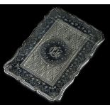 A Victorian silver card case, engraved with scrolls, geometric devices etc., surrounding a