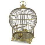 A Continental brass bird cage, with pierced base, scroll cast feet, 30cm H.