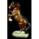 A Beswick brown rearing horse, impressed number 1014, 26cm H.