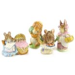 Four Beswick Beatrix Potter figures, Squirrel Nutkin, Mrs Rabbit, Appley Dapply and Hunca Munca, all