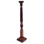 A late 19th/early 20thC mahogany torchere, with dished top, fluted column and a square base, 158cm