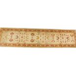 An Afghan Chobi Ziegler style runner, on a beige ground, 370cm x 88cm