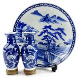 A pair of Chinese porcelain blue prunus pattern vases, 17cm H, and an oriental blue and white plate,