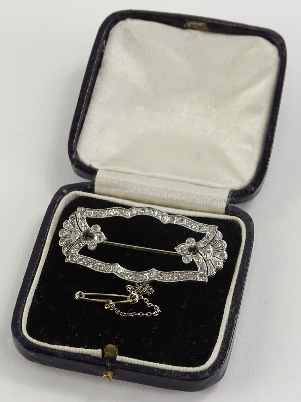 A diamond and sapphire Art Deco brooch, the design set with tiny diamonds, with a fan to each end, - Image 3 of 3