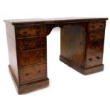 A Victorian walnut kneehole desk, the rectangular top with a green leather inset above four drawers,