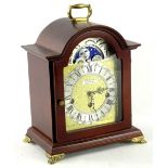 A mahogany case German mantel clock in George III style, the arched dial stamped H Samuel, 30cm H.
