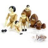 A collection of seven articulated wooden peg dolls, for inside eggs, handmade by Eric Horne of