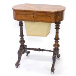 A Victorian walnut and marquetry work table, the hinged lid enclosing a writing surface, with